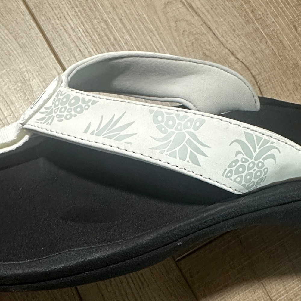 OluKai Women’s Flip Flop Sandals. White with Pineapples - Picture 8 of 10